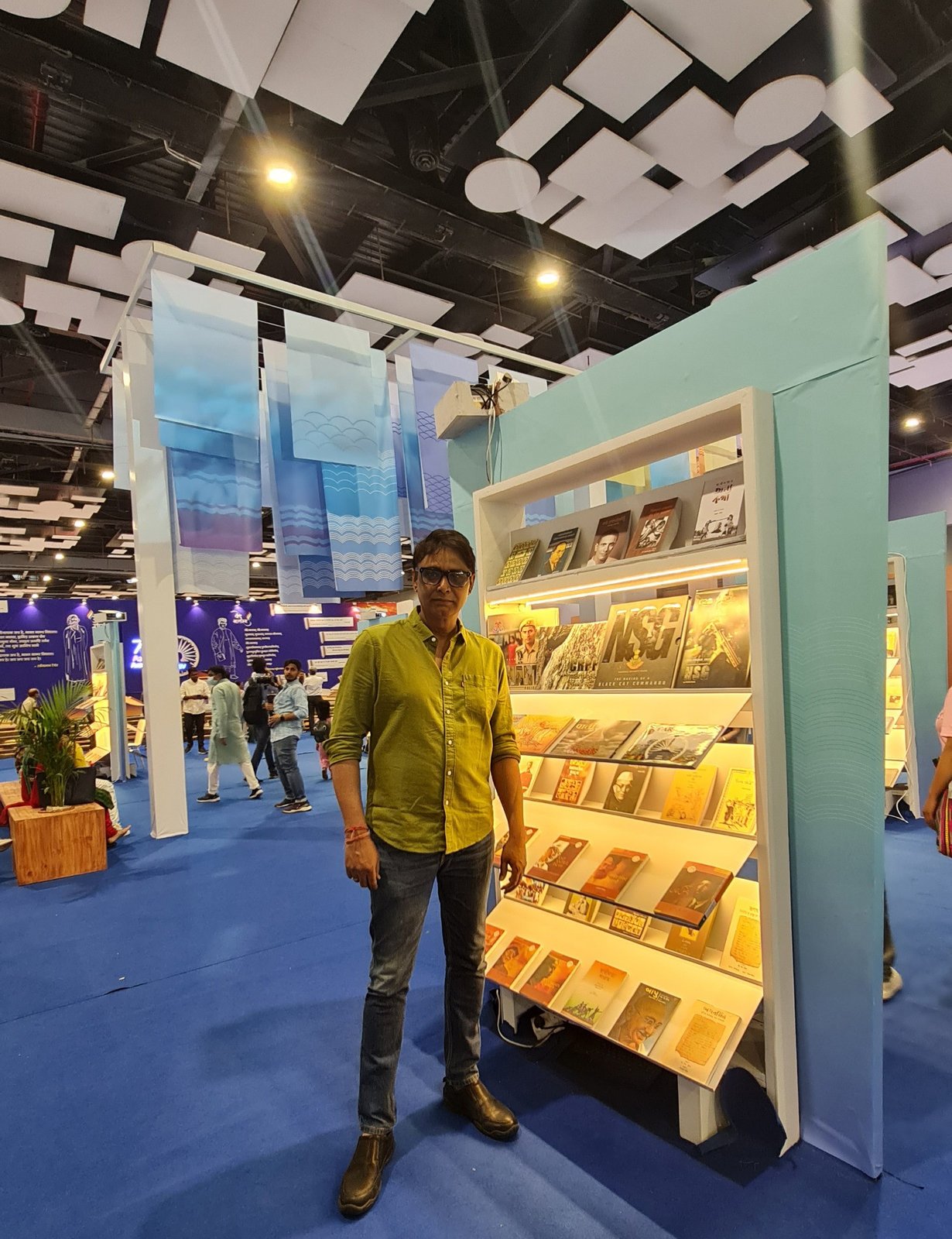 Pravin Talan beside the NSG book display at the Azadi Ka Amrit Mahotsav theme stall, Delhi World Book Fair, organised by the National Book Trust.