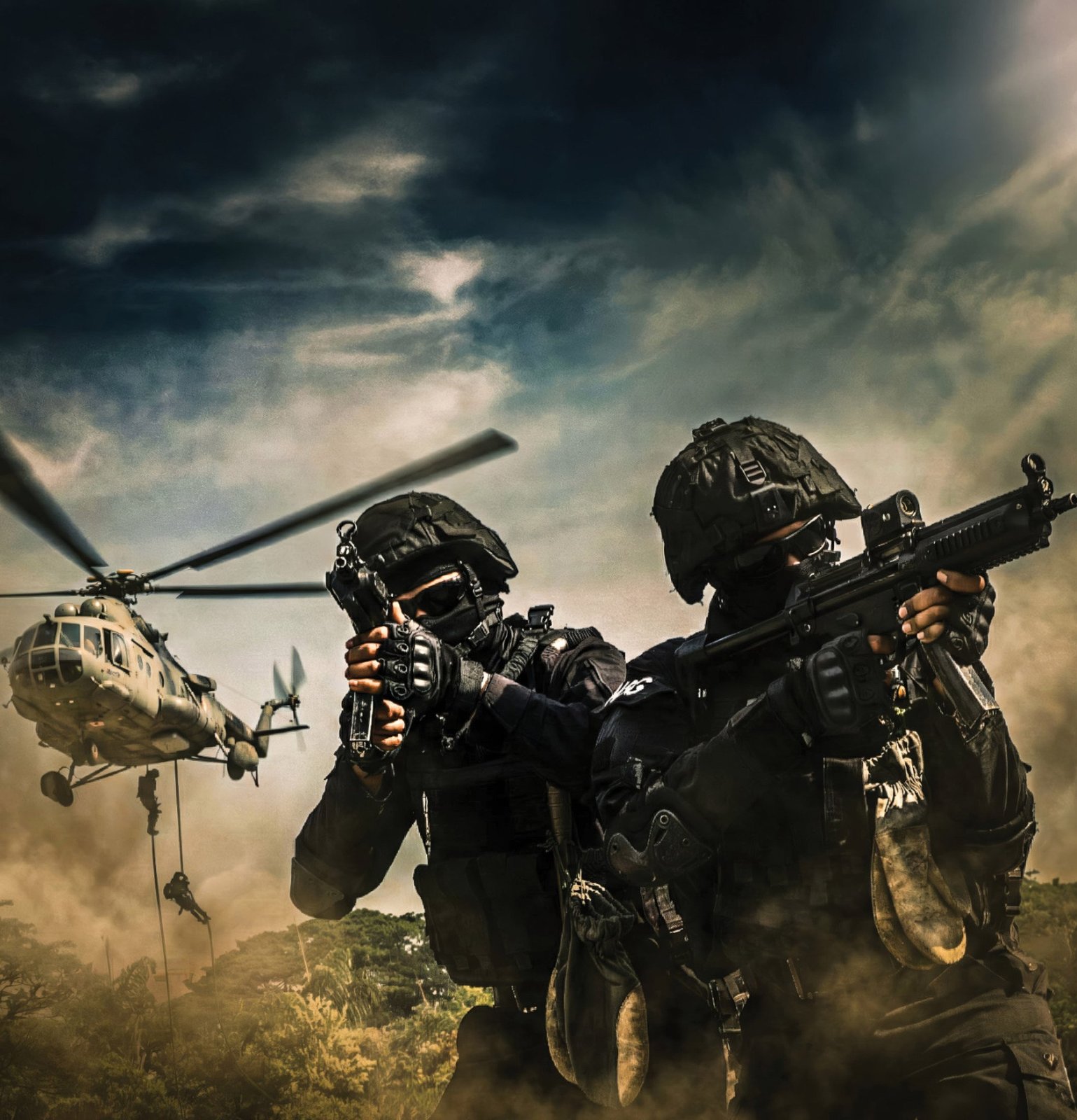 A helicopter overhead, commandos on the rope and a team on the ground. Helicopter-insertion training.