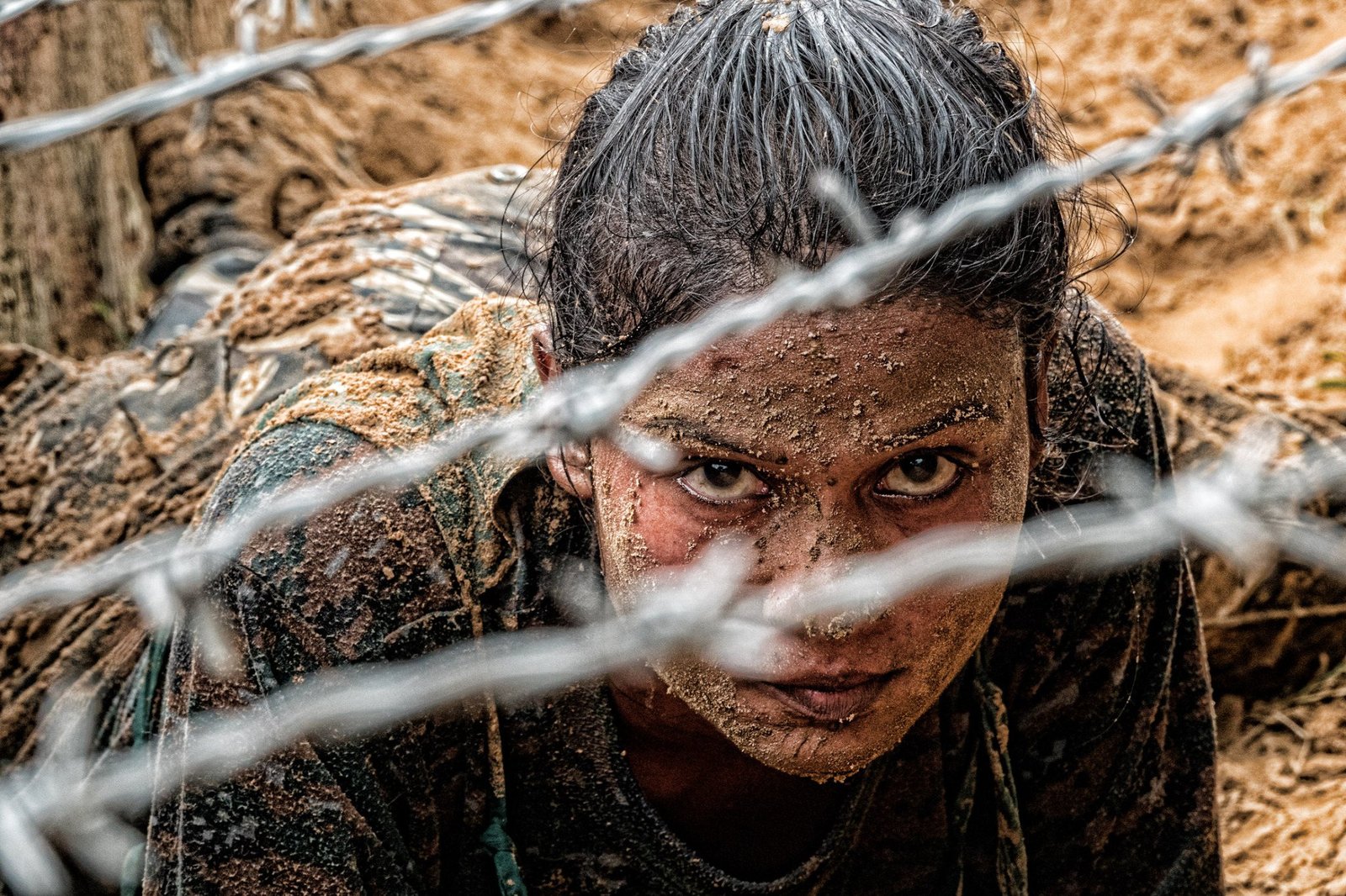 Mud, barbed wire and a gaze that holds the frame. Featured in the April 2023 NSG calendar.